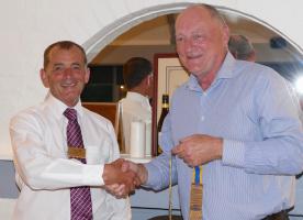 James receives the President's chain from Perry