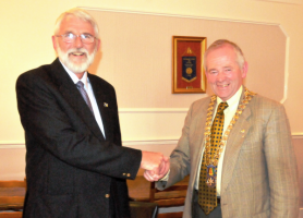 Outgoing 2010-11 President John presents incoming President Robert with his chain of office.