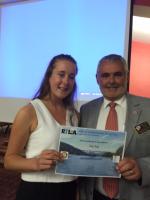 Katy Varty receives her certificate from DG Malcolm