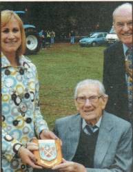 The Mayor of Abergavenny, Samantha Dodd, is pictured making the presentation to Ken Broadbank accompanied by Rotary Club President, Brian Roussel.