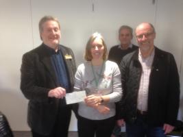 Louise Crawley, of the Limelight Friendship Group, receives the Community Grant from Paul Edwards, President of Matlock Rotary Club