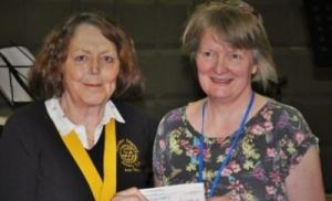 Ann House, Senior VP, presents a donation of £1,000 to the LivingWell Cafe