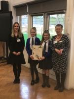 Rotary Club President Carole Baldam (Right) and Rotaractor Bex Cooke present the book Lost Words to students at St Joseph’s school