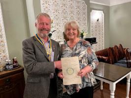 President Francis presents Gail with Certificate of Membership