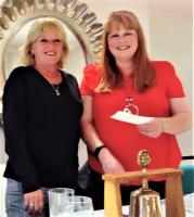 Nicola Watkins (right) receives a cheque from Llandudno Rotary for “Friends of Queen’s Park”