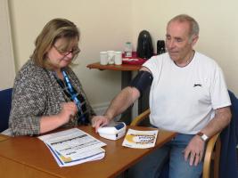 Nurse Karen Fenwick taking the blood pressure of Terry Burgess.