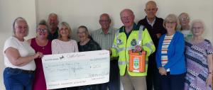 Knaresborough Harmony Oddfellows group with Rotarian and First Responder Jonathan Beer holding a defibrillator.