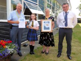 Sophie received her award from Rtn. Steve Parkin (left), also present are Rtn. Jean Shrubb and Towers School Principal Richard Billings