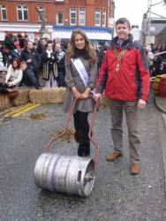 President Elfed and Denbigh Town Councillor Rachel Tate walk the Roll the Barrel course on High Street to show the public the type of barrel to be used to allow women and girls to make lighter work of carrying water to their homes. 