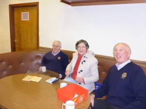 Ken, Elisabeth and Bill selling Raffle tickets