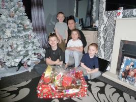 In our photo are Laura and her 4 children, Harley, Connor, Kieran and Kristal, with the hamper that was donated by our generous readers.