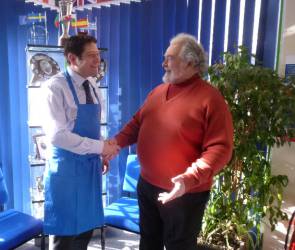 Youth Services Chair Alwyn presents aprons to Mr. S. Molloy Head teacher of Denbigh High School