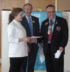 The presentation of the participation certificate to Cadi by 1190 District Governor Rotarian Kevin Walsh.
