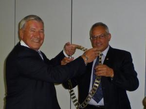 President Robert Dickie passes on the chain of office to incoming President Bill Crombie