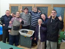 Excited members of the Friary Gardeners pottery group with their new potter’s wheel.