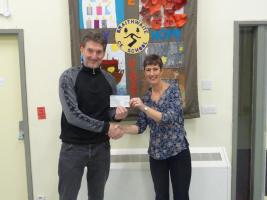 Paul Bowmer handing over a check for £200