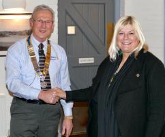 A New Rotarian is welcomed by President Graham.