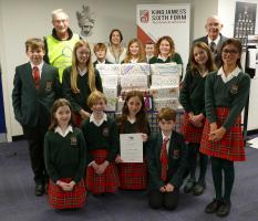 King James’s School, Knaresborough Year 7 pupils and Business Services Assistant Phoebe Logan, present their filled shoeboxes to Rotary President, David Kaye, and Shoebox co-ordinator Rotarian David Druett.