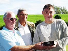 Rick Riley receiving the trophy from International chairman Gordon watched by organiser Archie.
Competitors from local bowling clubs took part to rais funds for International Charities.