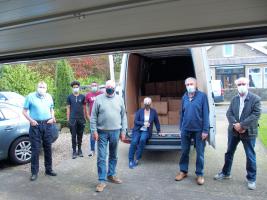 The boxed books packed in a van for transport