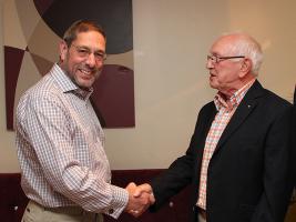 Malcolm receiving the award from President Keith Wood