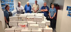 Rotarians and staff at the Co-op Sandwich ready the boxes for collection and distribution