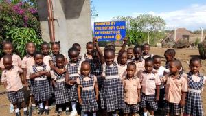 Picture of students at Bright Future school holding a Penrith Rotary sign