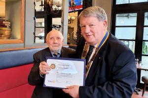John Galbraith receiving his PHF certificate from President Colin Morton