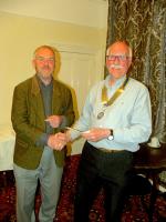 Paul Allen receives a cheque from Rotary Club of Tywyn President Anthony Pearson