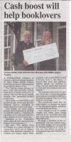 Ken Morrison with cheque to RNIB Angela Preston