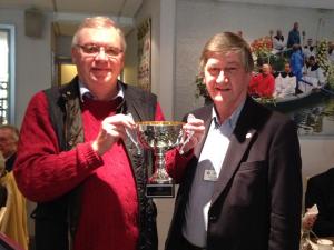 Peter Webb is awarded the RAGS trophy by Mike Baker