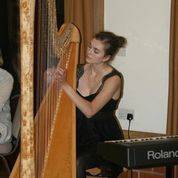 Imogen Ridge playing the harp.