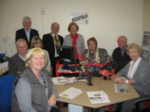 President Peter Mehta presents Ella Kennedy MBE at RockTalk with a cheque in the RockTalk Recording Studio