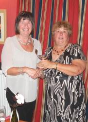 Immediate Past president of Dunbar Rotary Club, Elaine O’Brien (left) present The Douglas Rennie Cup to Dunbar Rotarian of the Year, Thelma Band. 