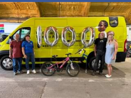 Rotarian Jackie Wellman and Rotarian Terry Morris deliver the Rotary Club of Rayleigh Mill’s 1000th bicycle for shipment to Africa