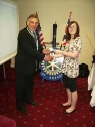 President Derek Ratcliffe presenting Gemma with a cheque to assist her in making the trip.