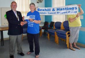 Past President Graham hands over the cheque.