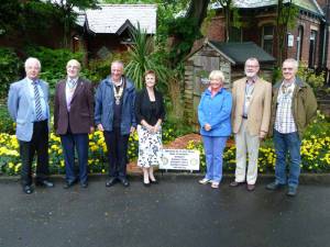 Ann Cobham with the four Rotary Presidents, and two Assistant Governors at Botanic Gardens.