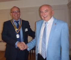 President Bill Farmer hands over his Chain of Office to new President Carl Watson