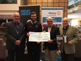 Gary Zabel (third from left), Immediate Past President of Leatherhead Rotary Club, presenting a cheque for £15,000 to Jack Bacon from Prostate Cancer UK, together with local Prostate Cancer UK supporters, Chris Eglinton and Andy Crompton.