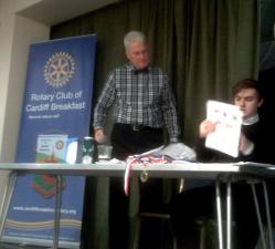 Quiz-master Steve and Interactor Rhys check the scores of the winning team