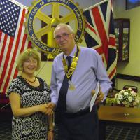 Mary Pritchard from the Garrick Theatre, receives a cheque from President Bill.