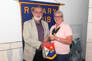 IPP David receiving a banner from President Denise Antrobus of the RC Mid Isle, Sint Maarten