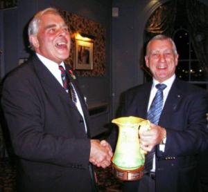 Colin receiving John's Jug from President David Adamson