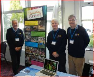 President John Harrison with Peter Tasker and Alan Haines in the excellent priory pullovers manning a display about the Rainbow Centre project