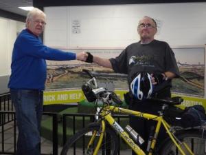 Rttn John Jacklin congratulates Ronny on the completion of his ride.