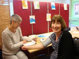 Sarah White - volunteer nurse - taking the blood pressure.