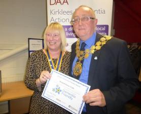 SUE CHARLESWORTH RECEIVING THE AWARD FROM THE MAYOR OF KIRKLEES