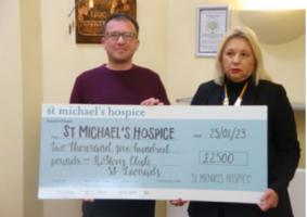 President Kim Hollis QC presents a cheque to St. Michael’s 
Hospice for £2500.