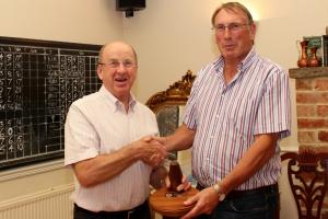 The winner in 2015 was Club Service and the committee chairman, Alan, receives the trophy from President Ken